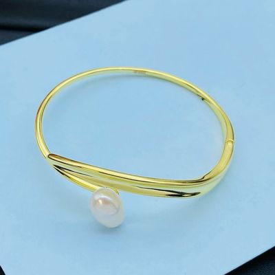 Elegant Gold Bangle with Pearl Accent