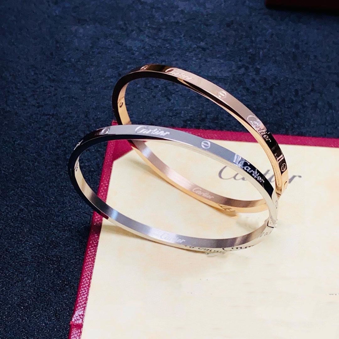 Elegant Gold-Tone Screw Motif Bangle Bracelet