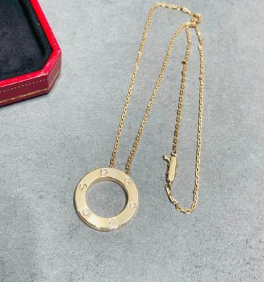 Elegant Circular Pendant Necklaces with Engraved Motifs