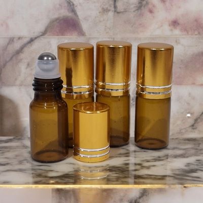 3ml Amber Glass Rollon with Metal Roller Ball (Clear Housing) and GOLD 2LINE Cap - 50PC PACK 3ml Amber Glass Rollon with Metal Roller Ball (Clear Housing) and GOLD 2LINE Cap - 50PC PACK