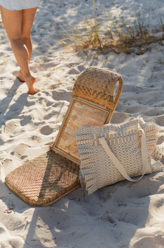 Woven foldable beach chair with carry strap Woven foldable beach chair with carry strap