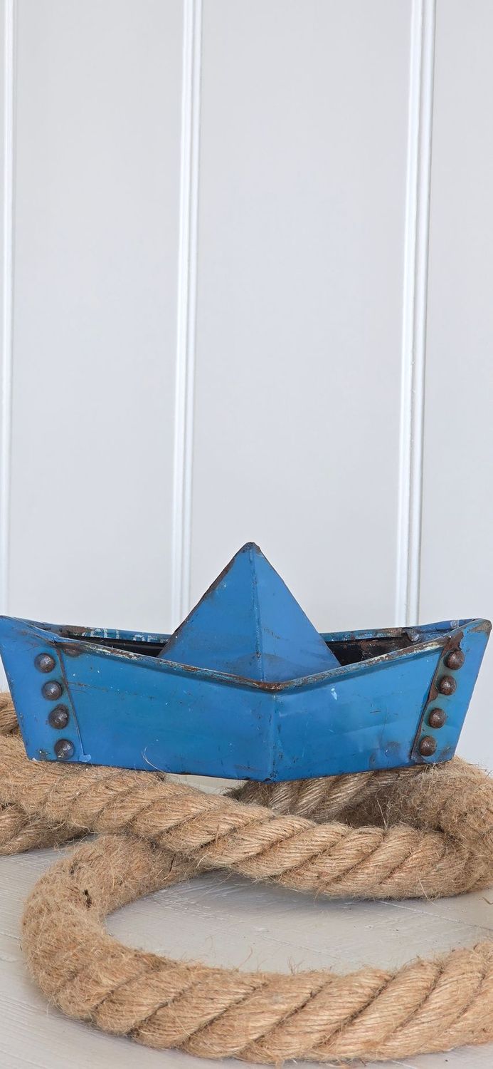 Metal paper boat in small