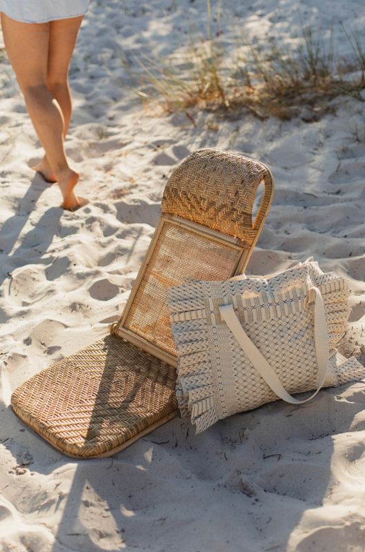Woven foldable beach chair with carry strap