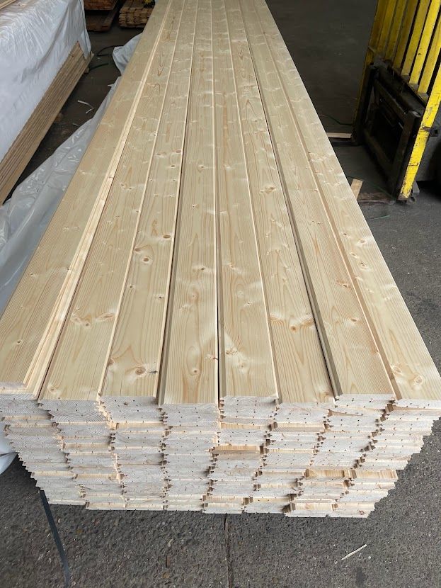 Stacked kiln-dried timber boards used to build custom-sized garden gates