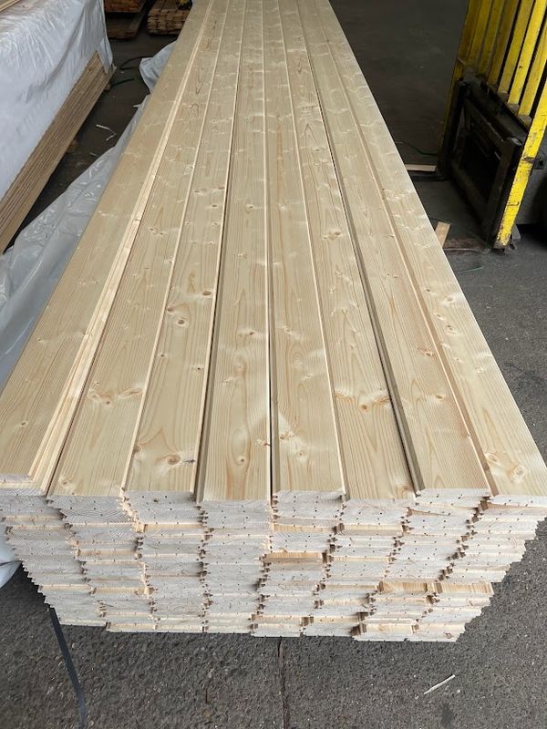 Stacked kiln-dried timber boards used to build custom-sized garden gates