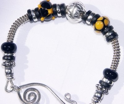 Black and Yellow Bangle Bracelet: Lampwork beaded,Onyx, Bali Silver Beads and Sterling Silver Wire
