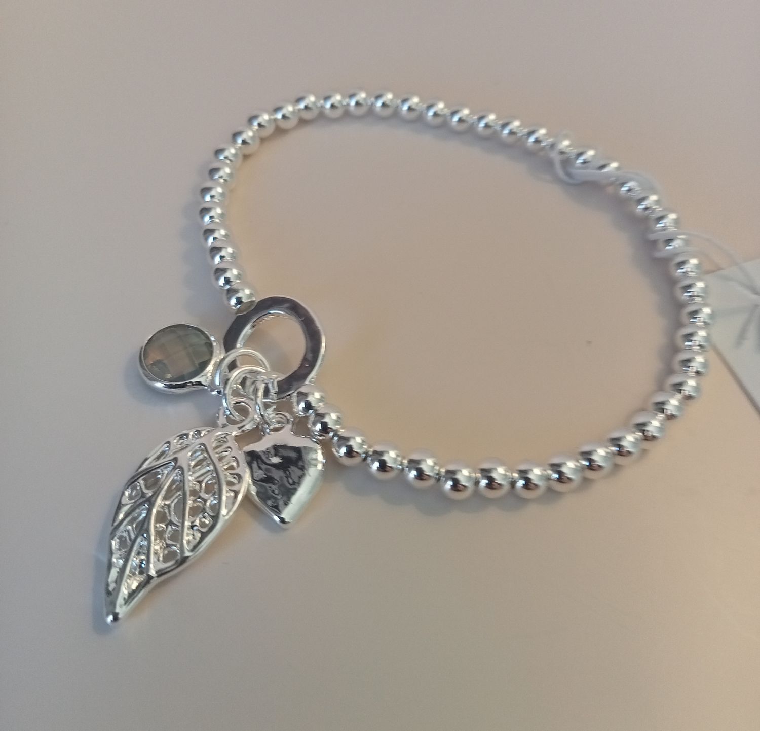Elasticated bracelets with leaf and heart charms
