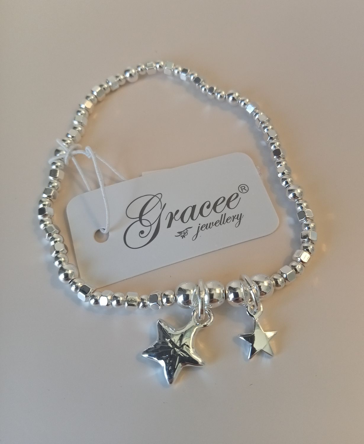 Elasticated bracelet with two stars