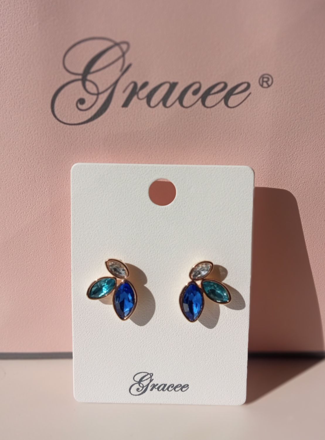 3 Stone gold tone earrings