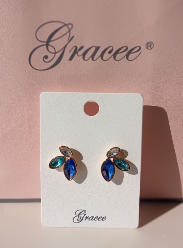 3 Stone gold tone earrings
