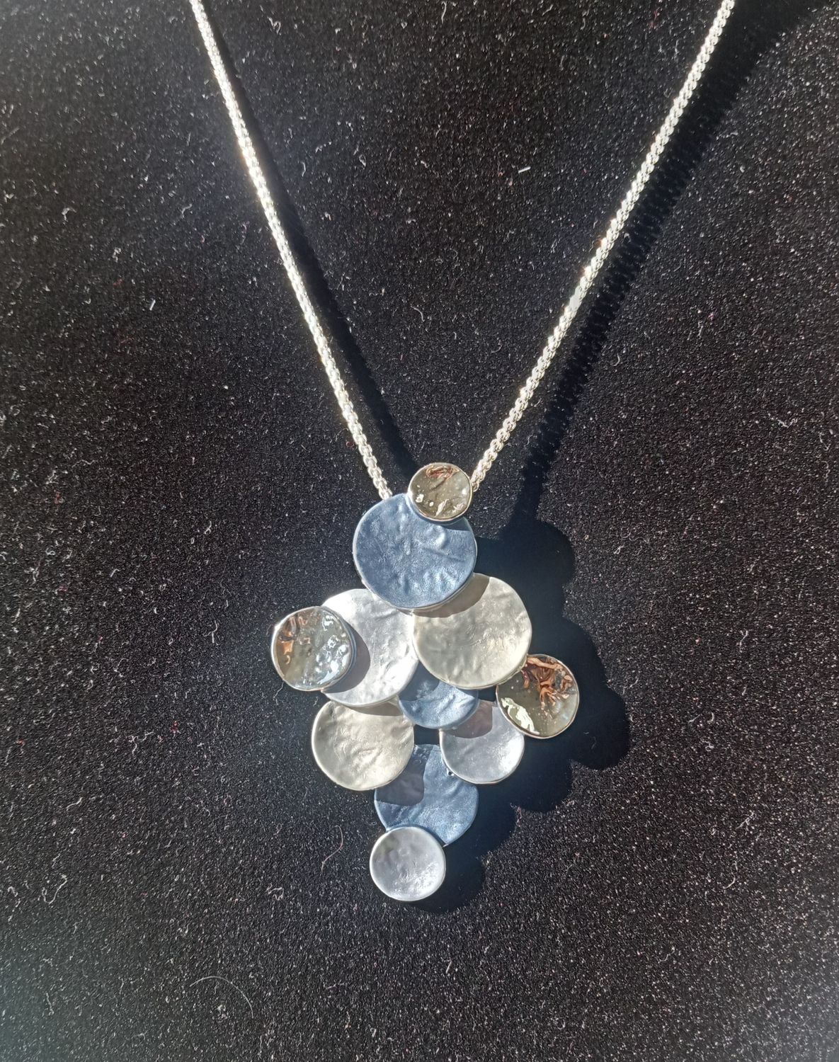Multi circle pendant in shades of blue and silver