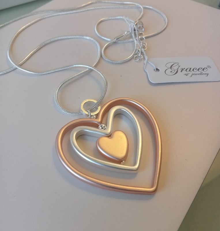 2 heart two tone long pendant