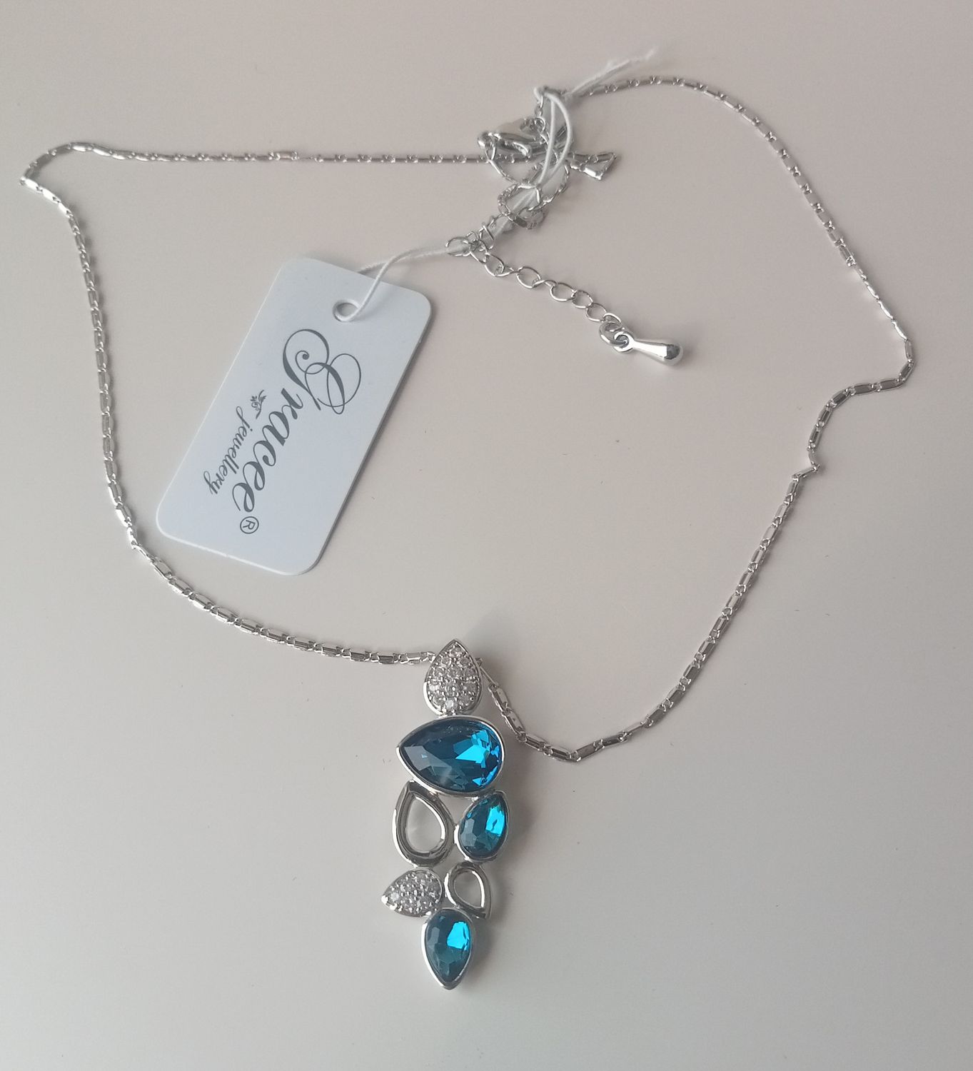Silver tone blue tear drop pendant