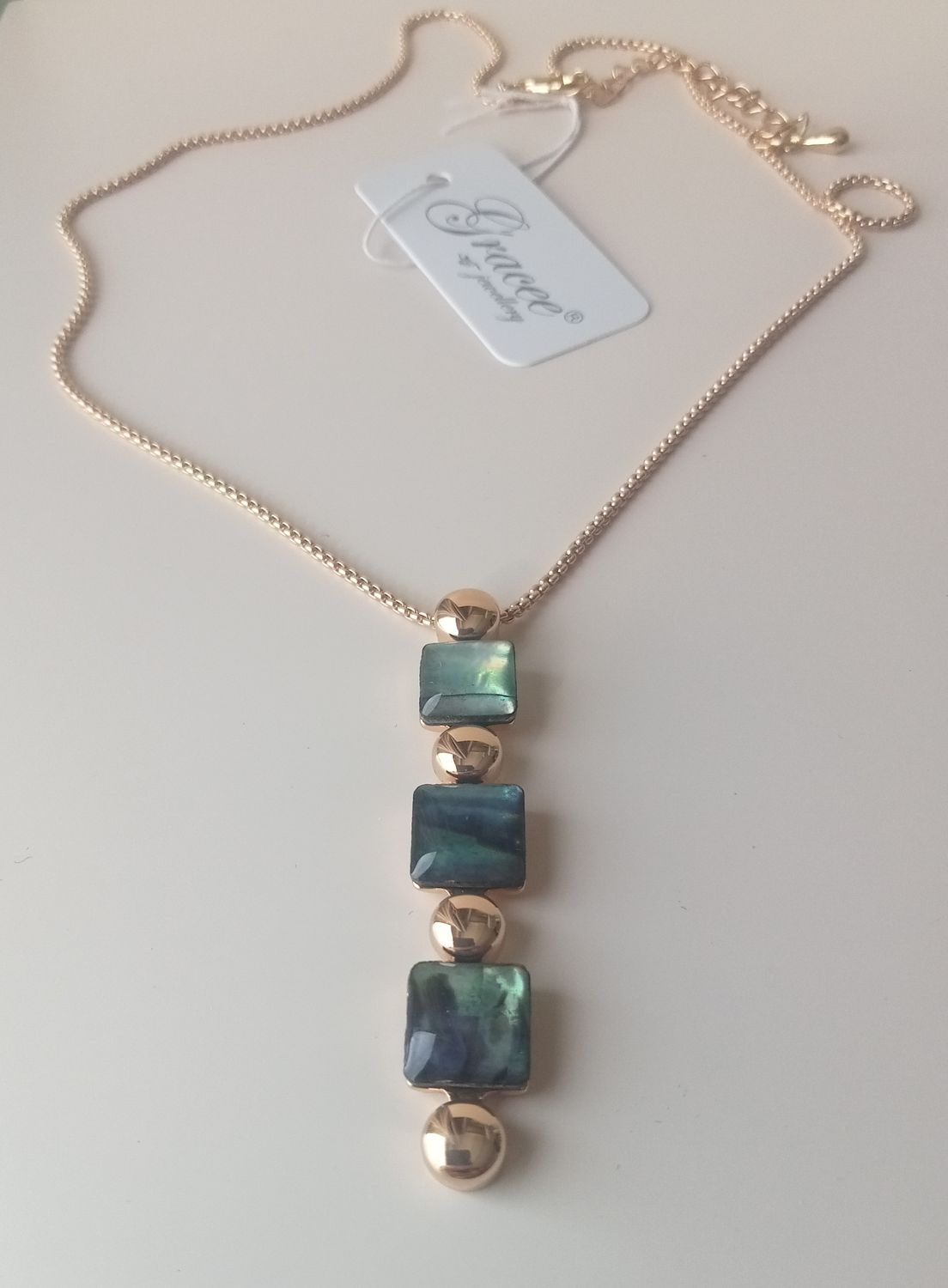 Gold tone green pendant