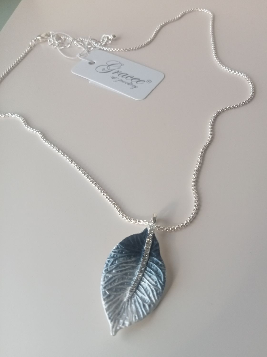 Blue graduated leaf pendant with diamante