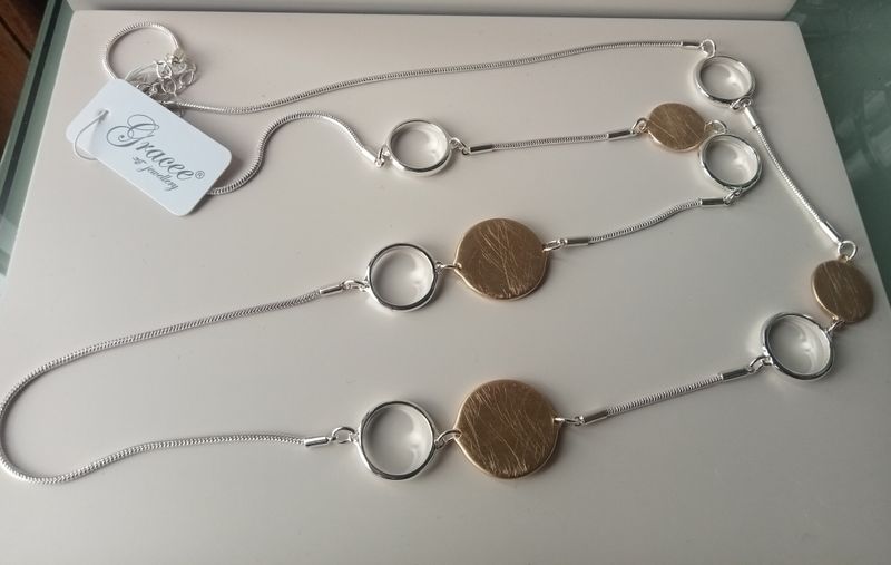 Long silver and gold tone necklace with circles