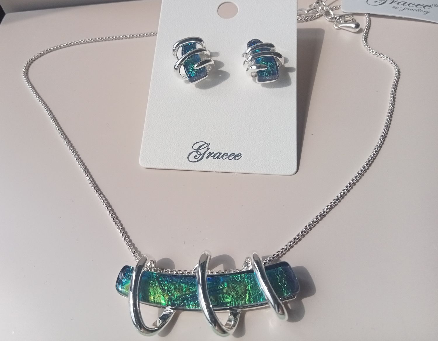 Green and blue stone earrings with silver spiral