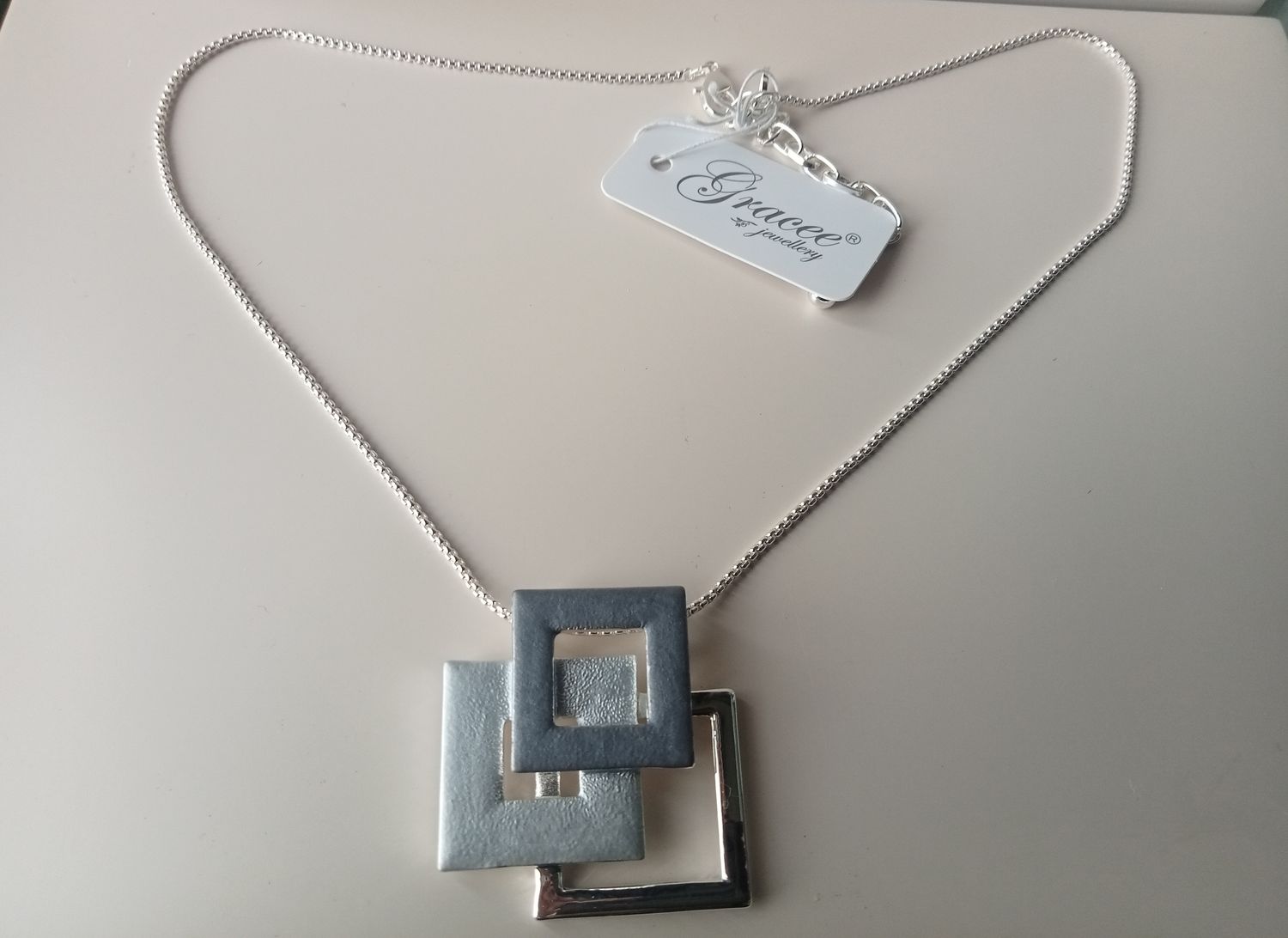 silver tone and grey squares pendant