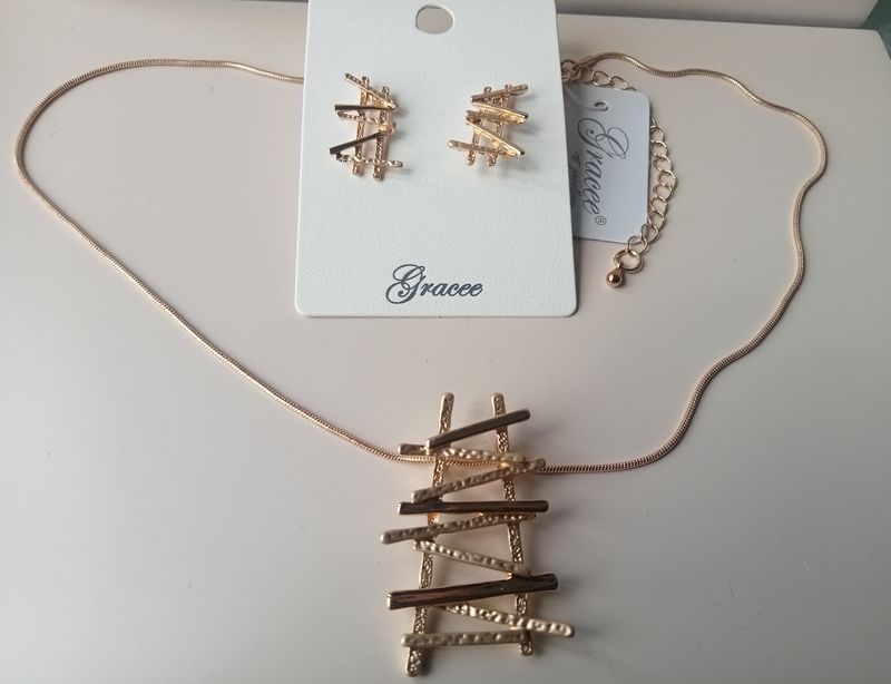 Gold tone sticks earrings