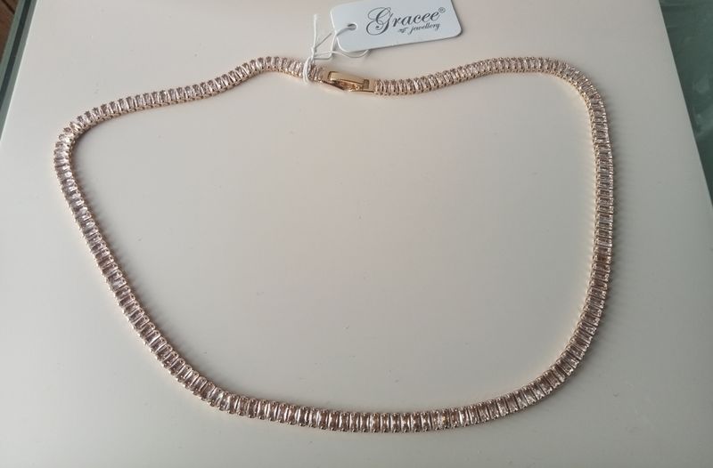 Gold tone baguette cut clear stone necklace