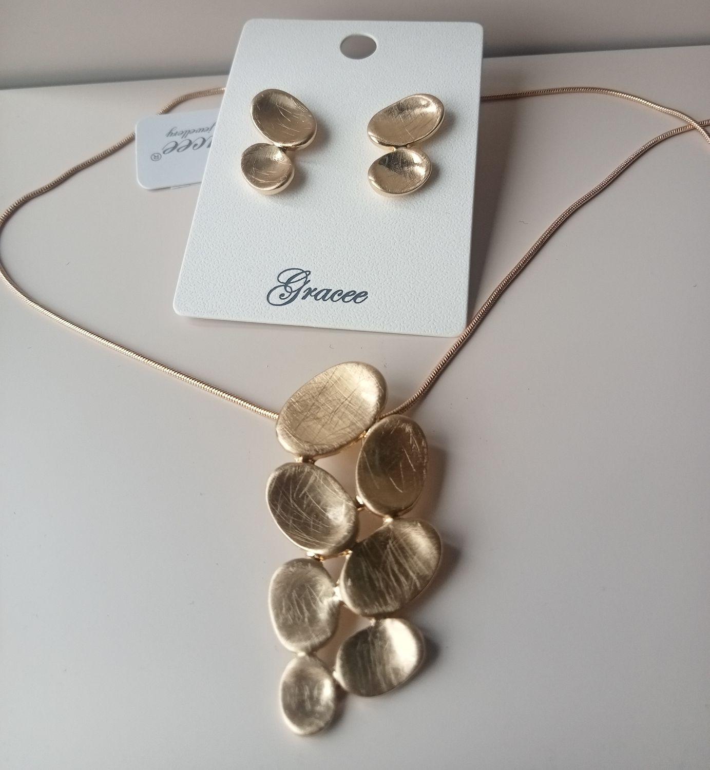 Gold tone pebble shaped earrings