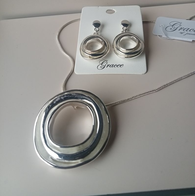 Silver tone large circle drop earrings