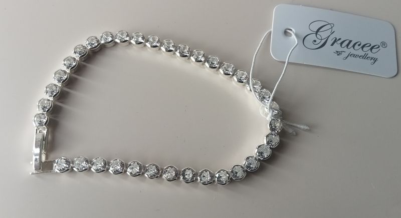 Silver tone tennis bracelet with clear stones