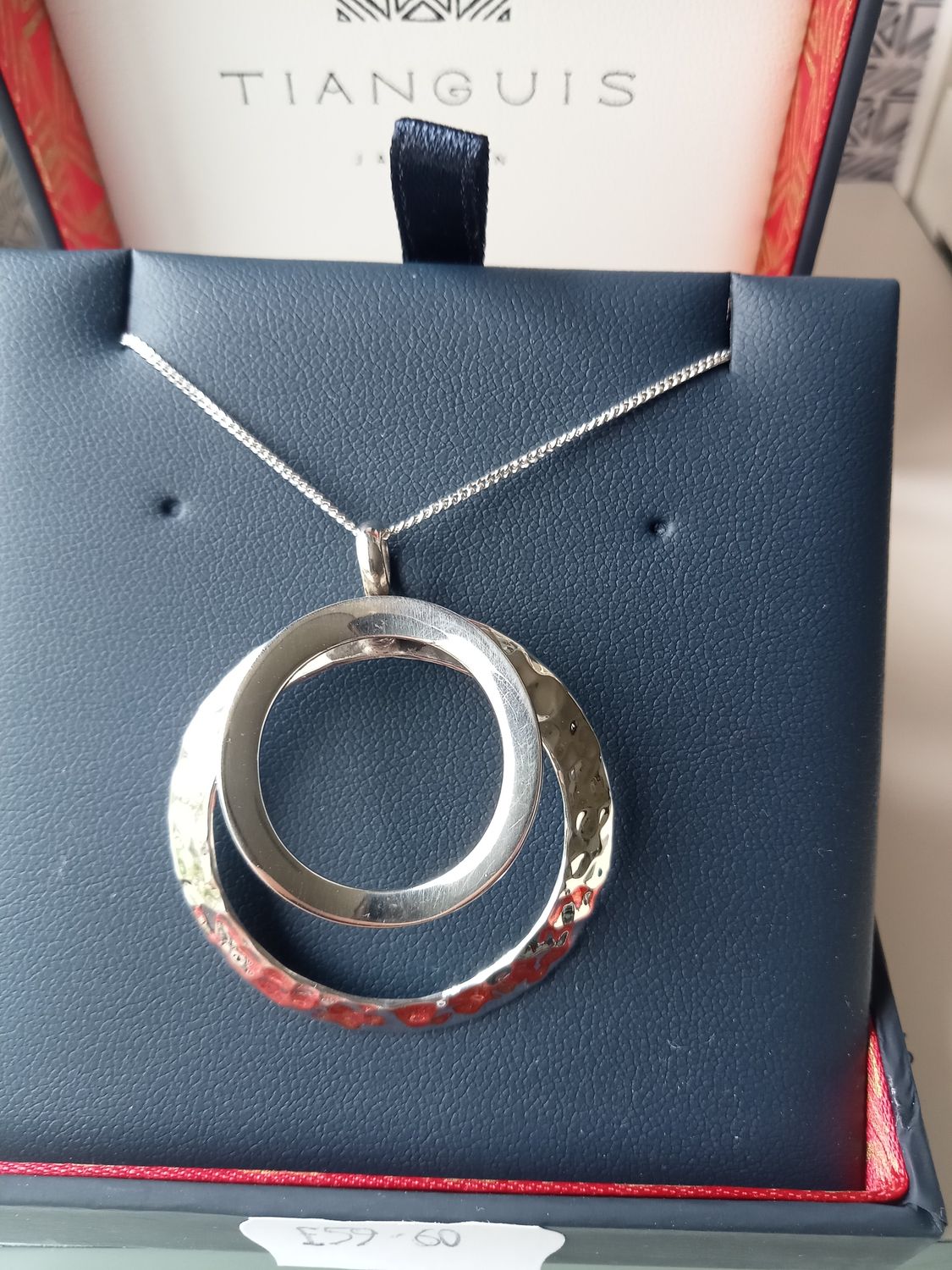 Two circle sterling silver pendant hammered and smooth