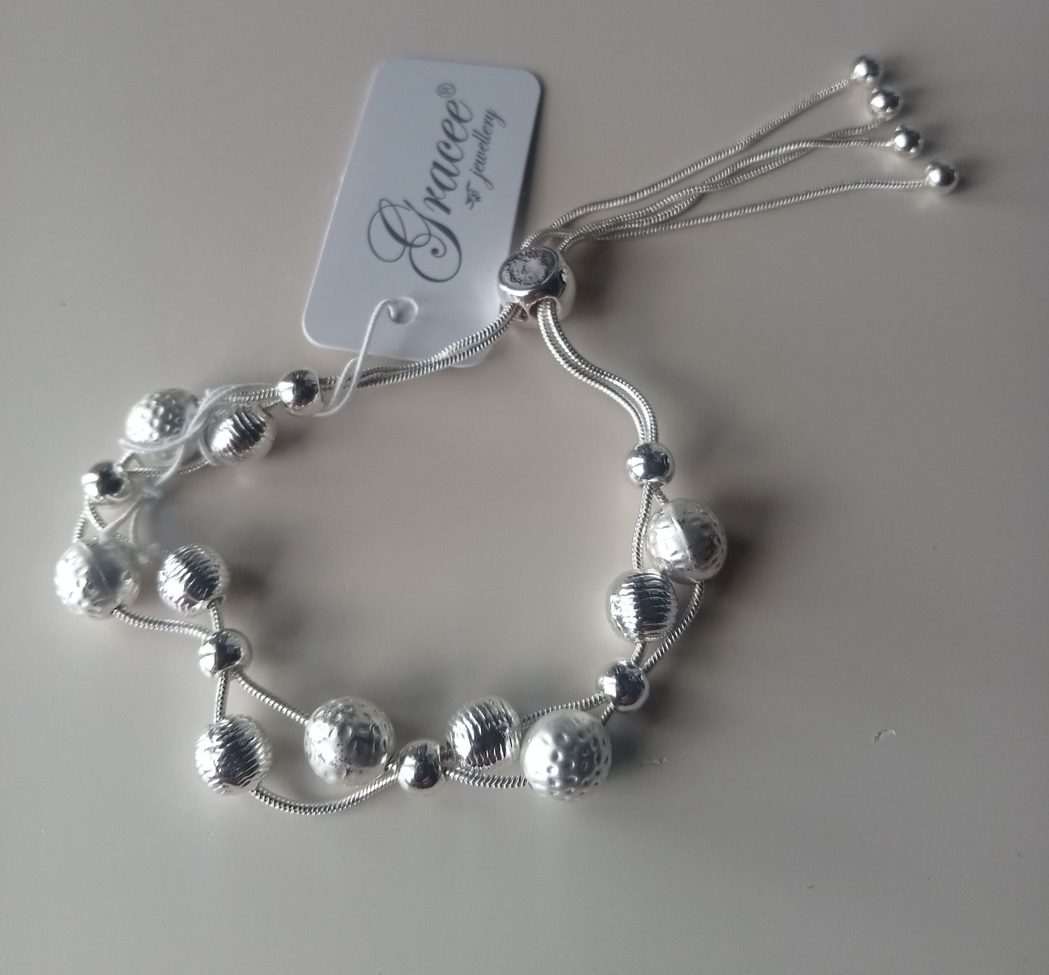 Adjustable multi ball bracelet