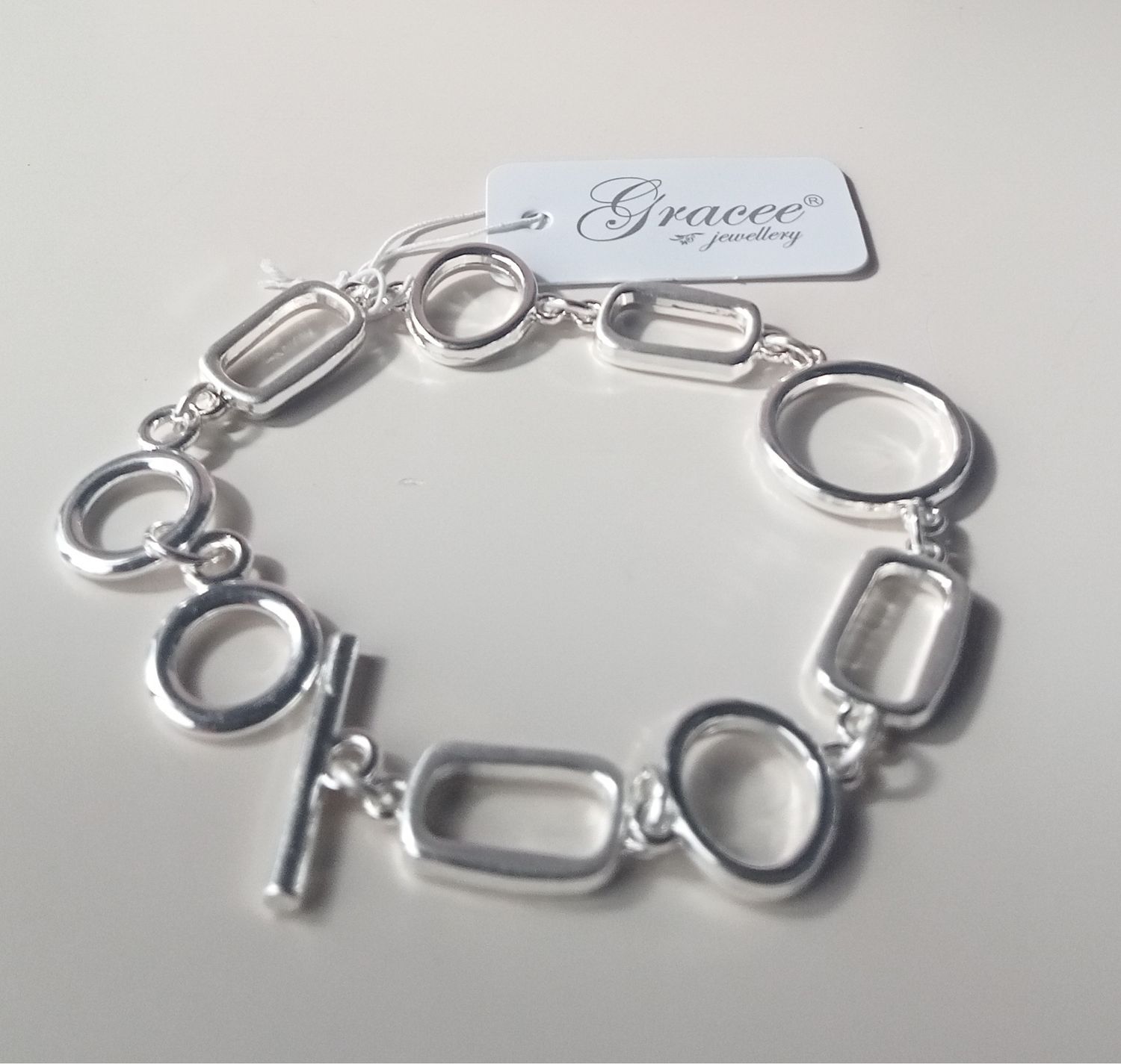 T Bar fastening chunky bracelet with round and rectangular links