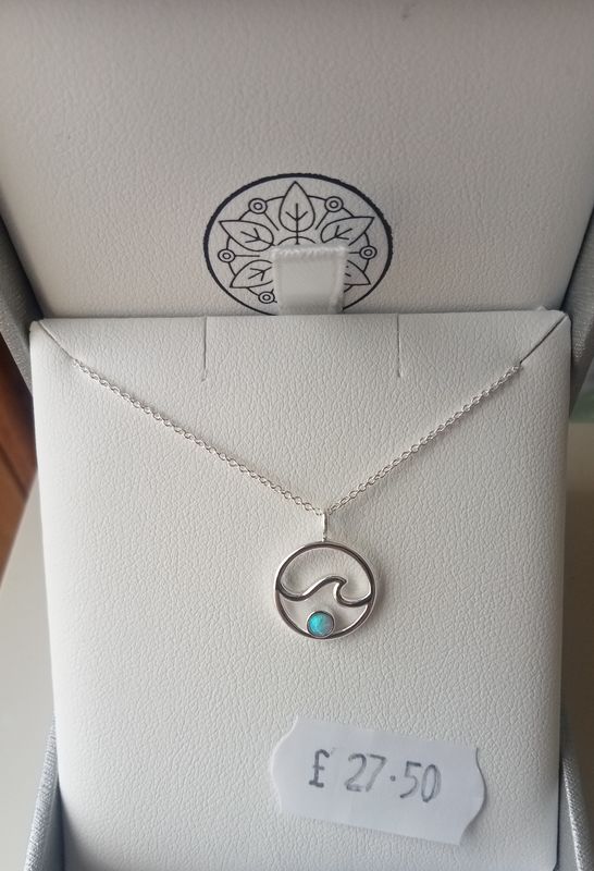 Kali Ma Sasha wave in circle with Blue Opalique necklace