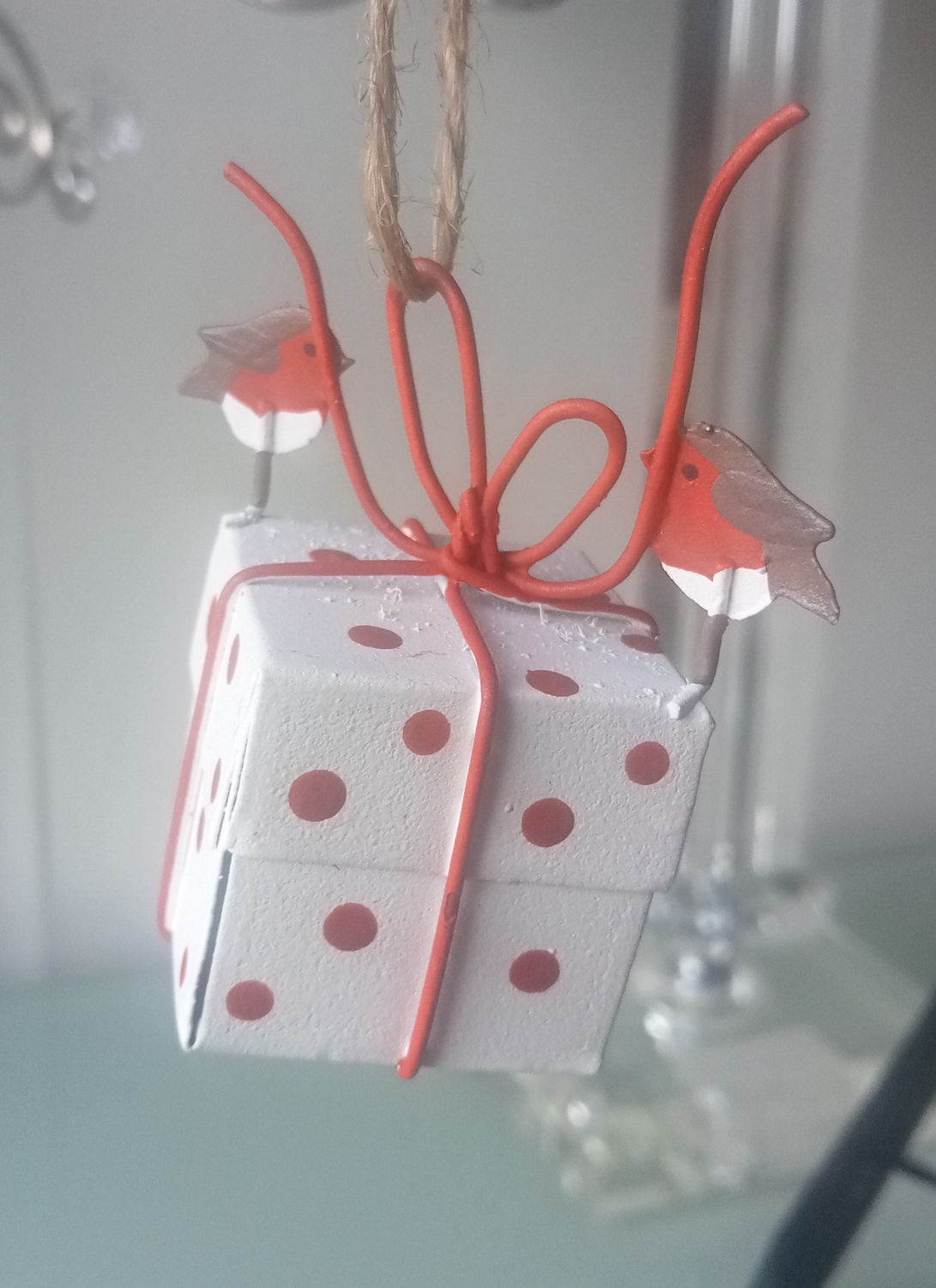 Two Robins helping to tie a parcel