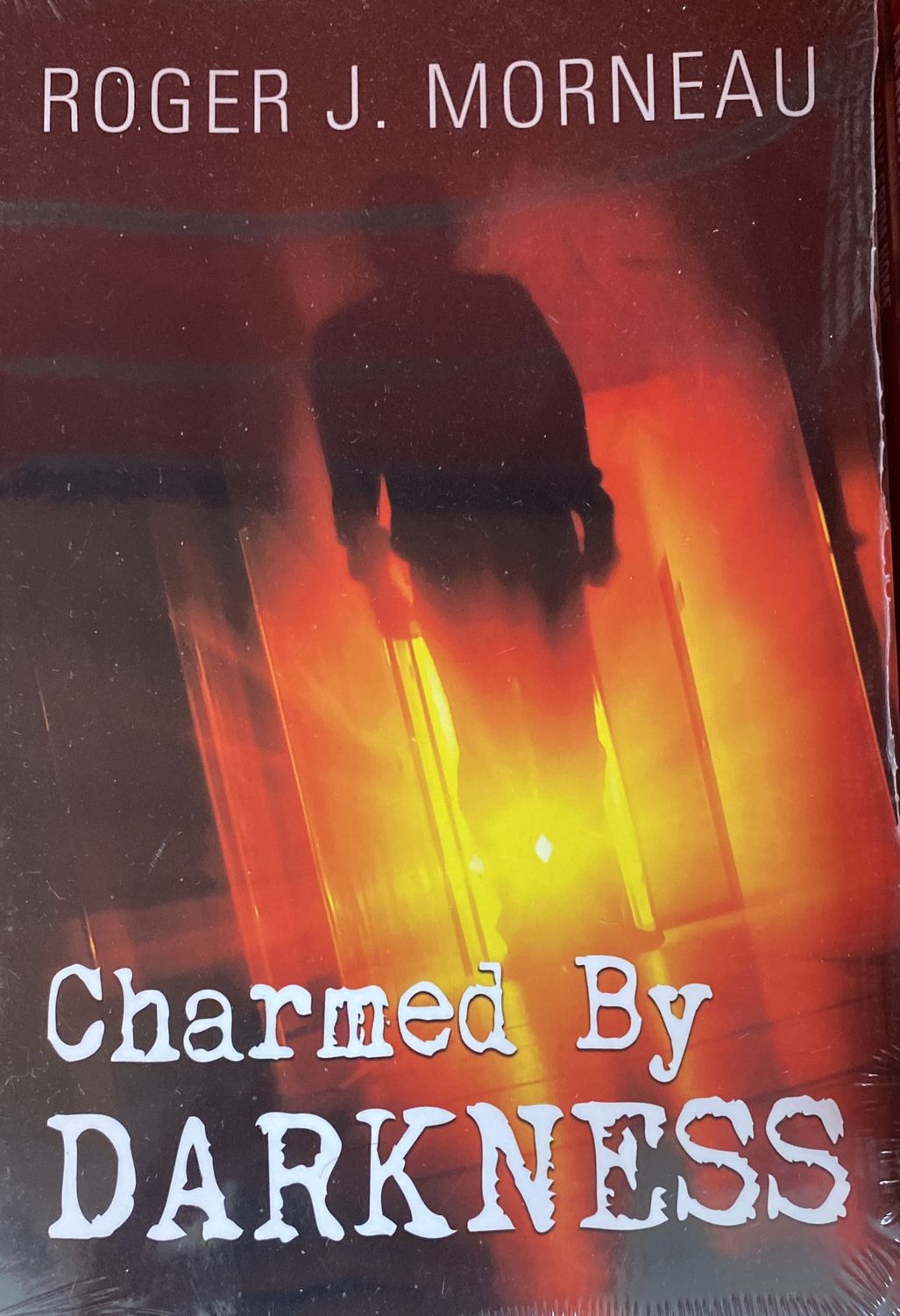 Charmed by Darkness, Roger Morneau