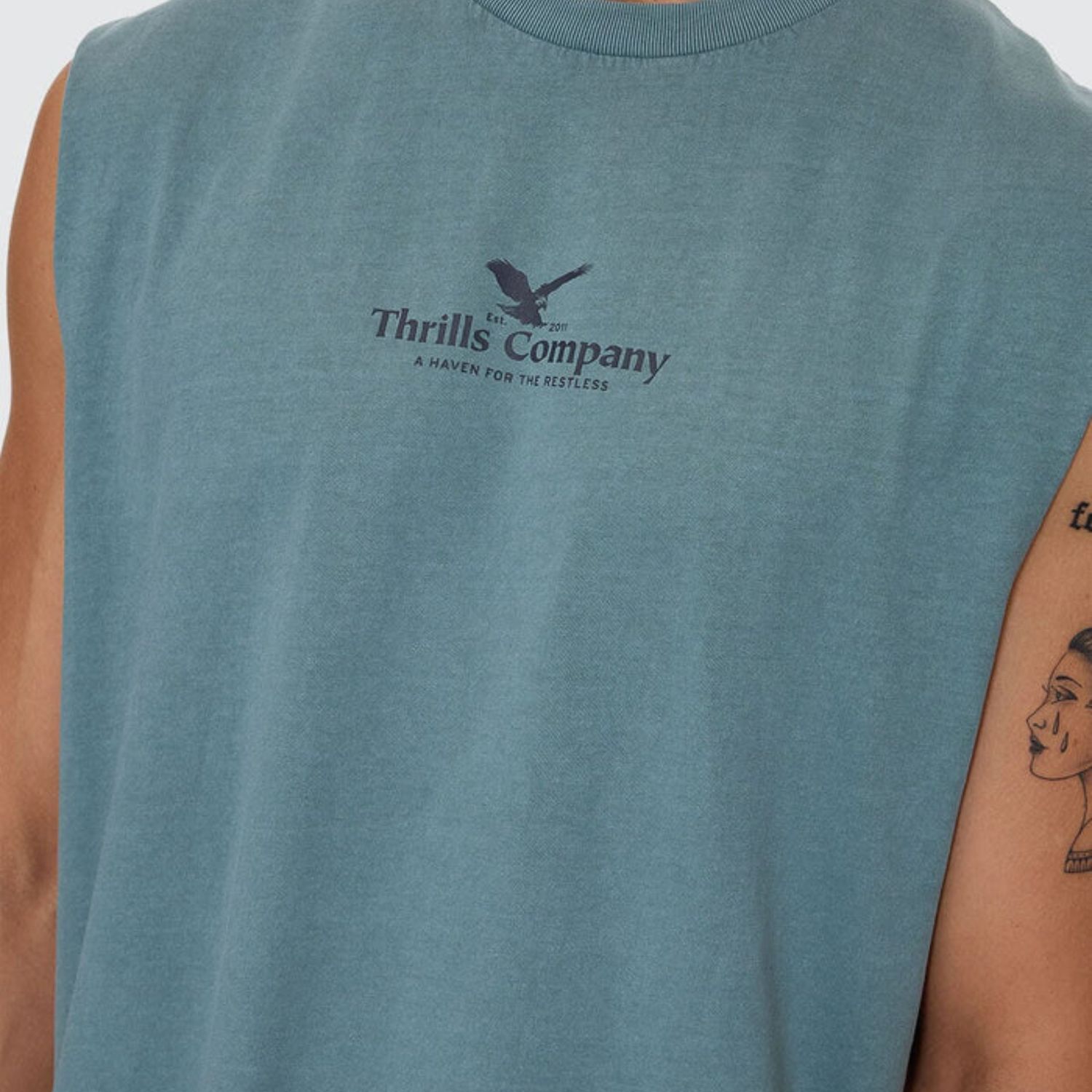 THRILLS MENS A HAVEN FOR THE RESTLESS MERCH FIT MUSCLE TEE- GREEN COAST