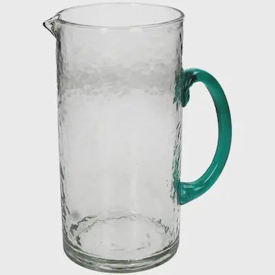Glazen karaf met groen handvat