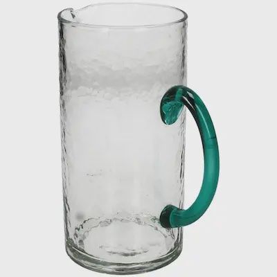 Glazen karaf met groen handvat