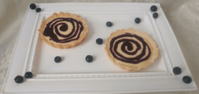 Delicate French Creme Tartlet w/Blueberry Compote Drizzle