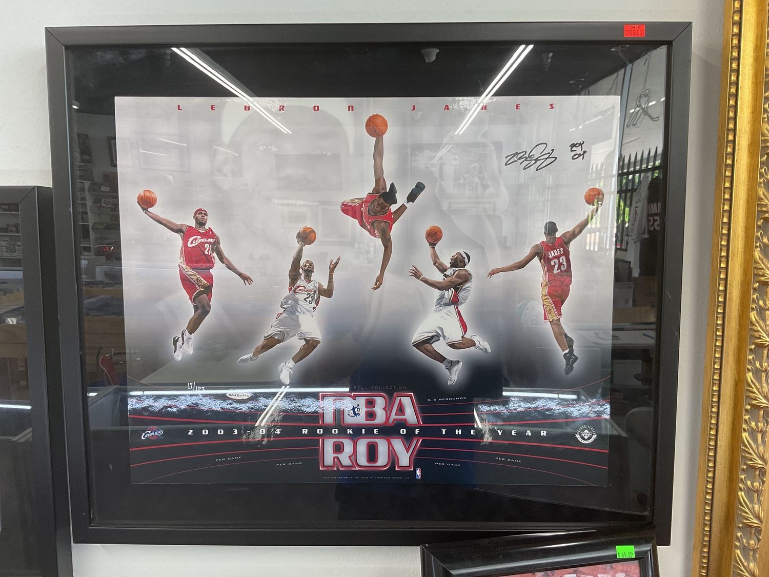 LeBron James Framed 2003-04 Rookie Of The Year Upper Deck Authenticated Autographed Display Piece. 21”x25”