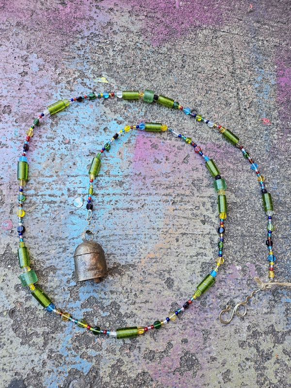 The Rainbow Color Strand Of Beads And Bell