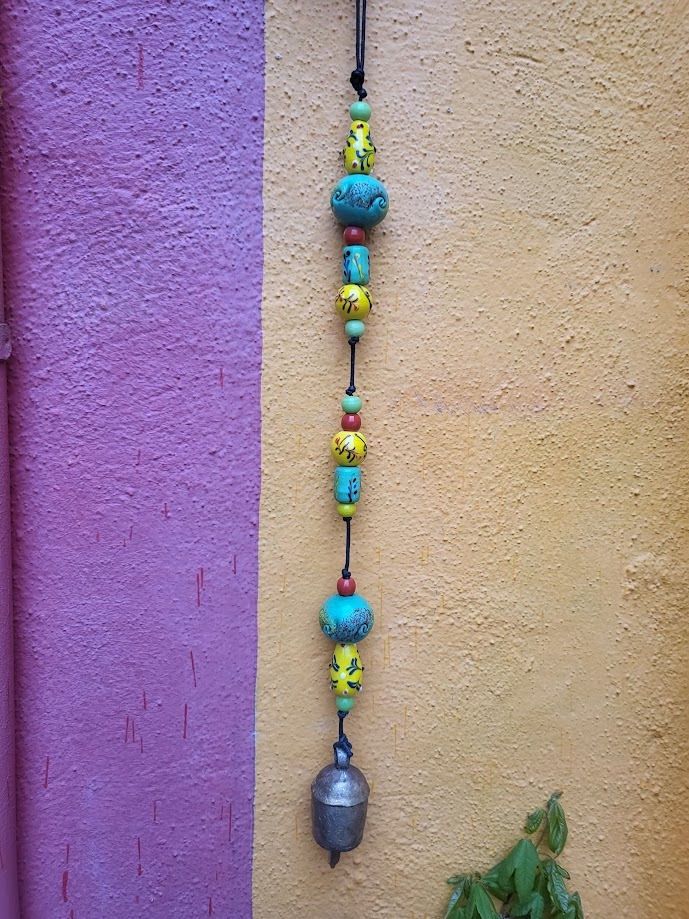 The Evergreen Blooms Strand Of Beads And Bell