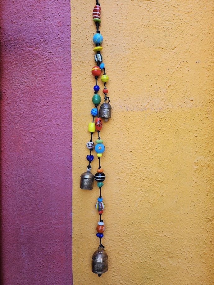 Triple Action Strand Of Beads And Bells