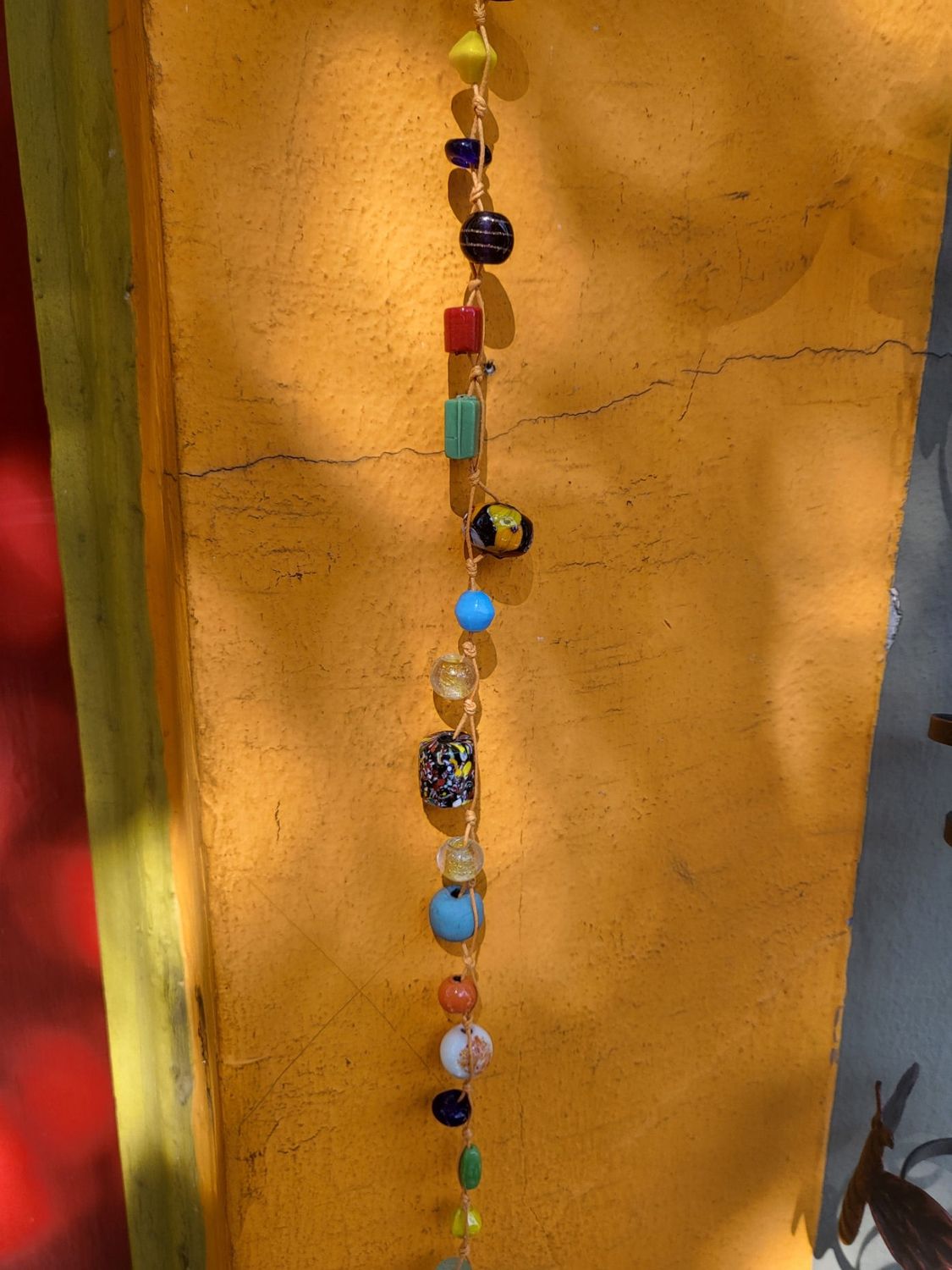 Rainbow Vibes Strand Of Beads And Bell