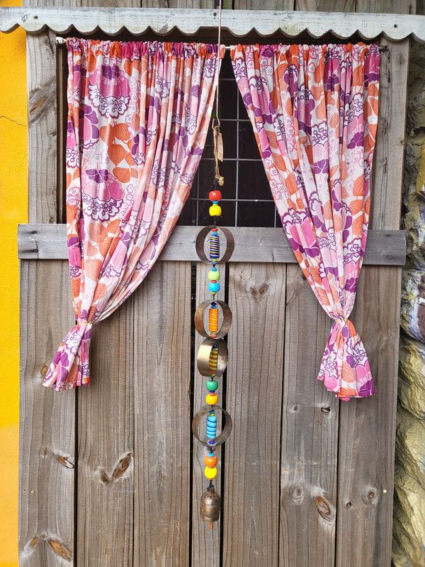 The Four Circles Beads And Bell