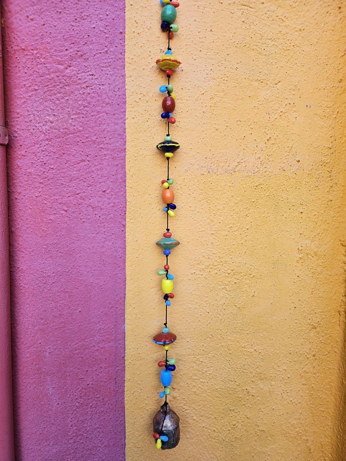 Strokes Of Color Beads And Bell