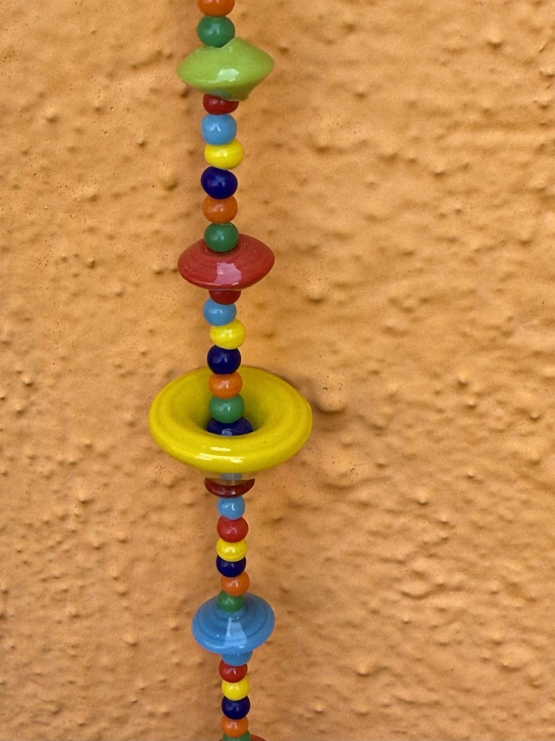 Where Colors Meet Strand Of Beads And Bell