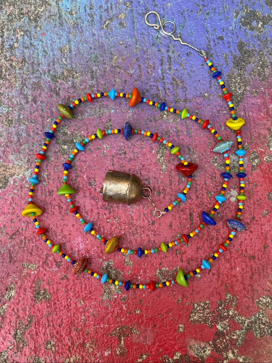 Where Colors Meet Strand Of Beads And Bell