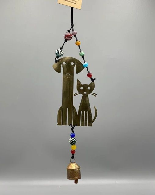 Cat And Dog Looking Cute Together Beds And Bell