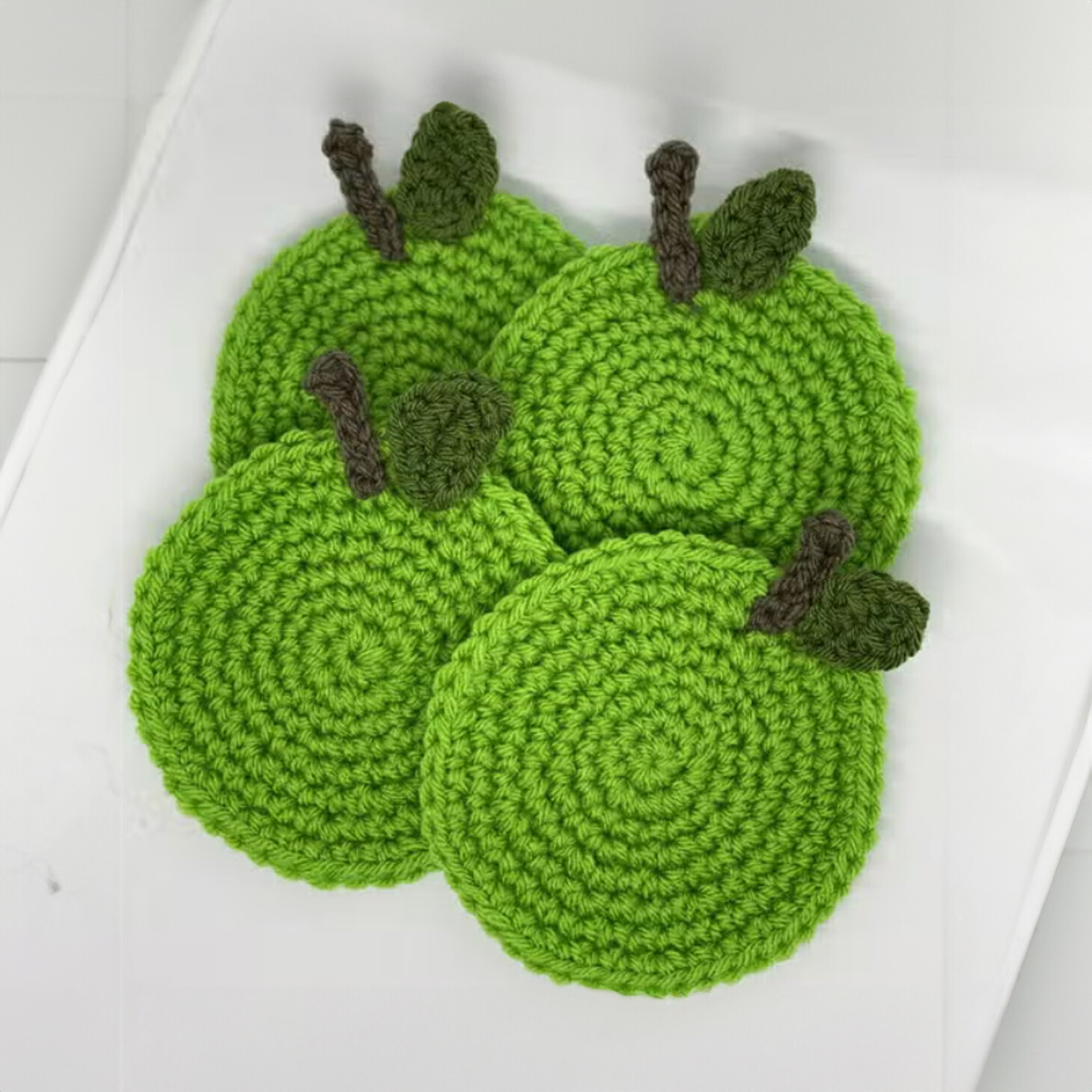 Charming Hand-Crocheted Green Apple Coasters