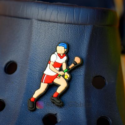 A hurling player looking for a pass in a Derry style kit