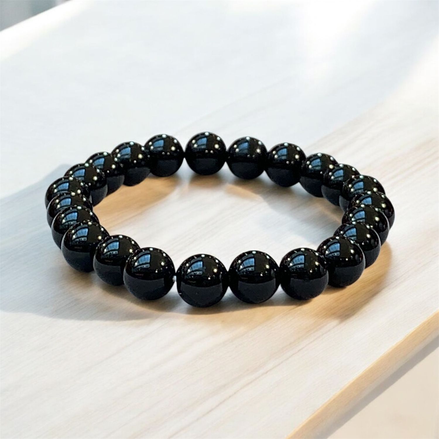 BRACCIALE OSSIDIANA DORATA